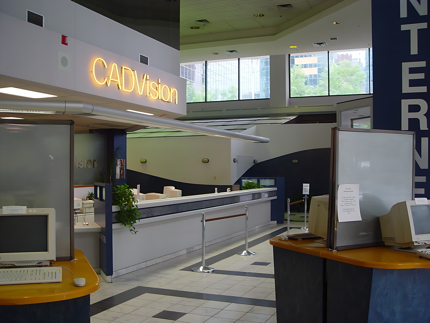 Interior of a building with a sign that reads "CADVISION" above the rece