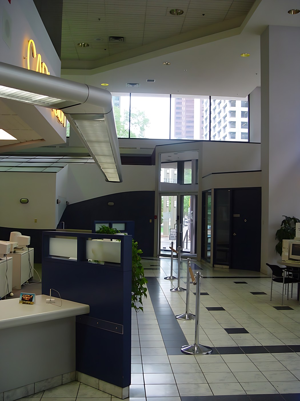 Interior of a modern building with a high ceiling and large windows