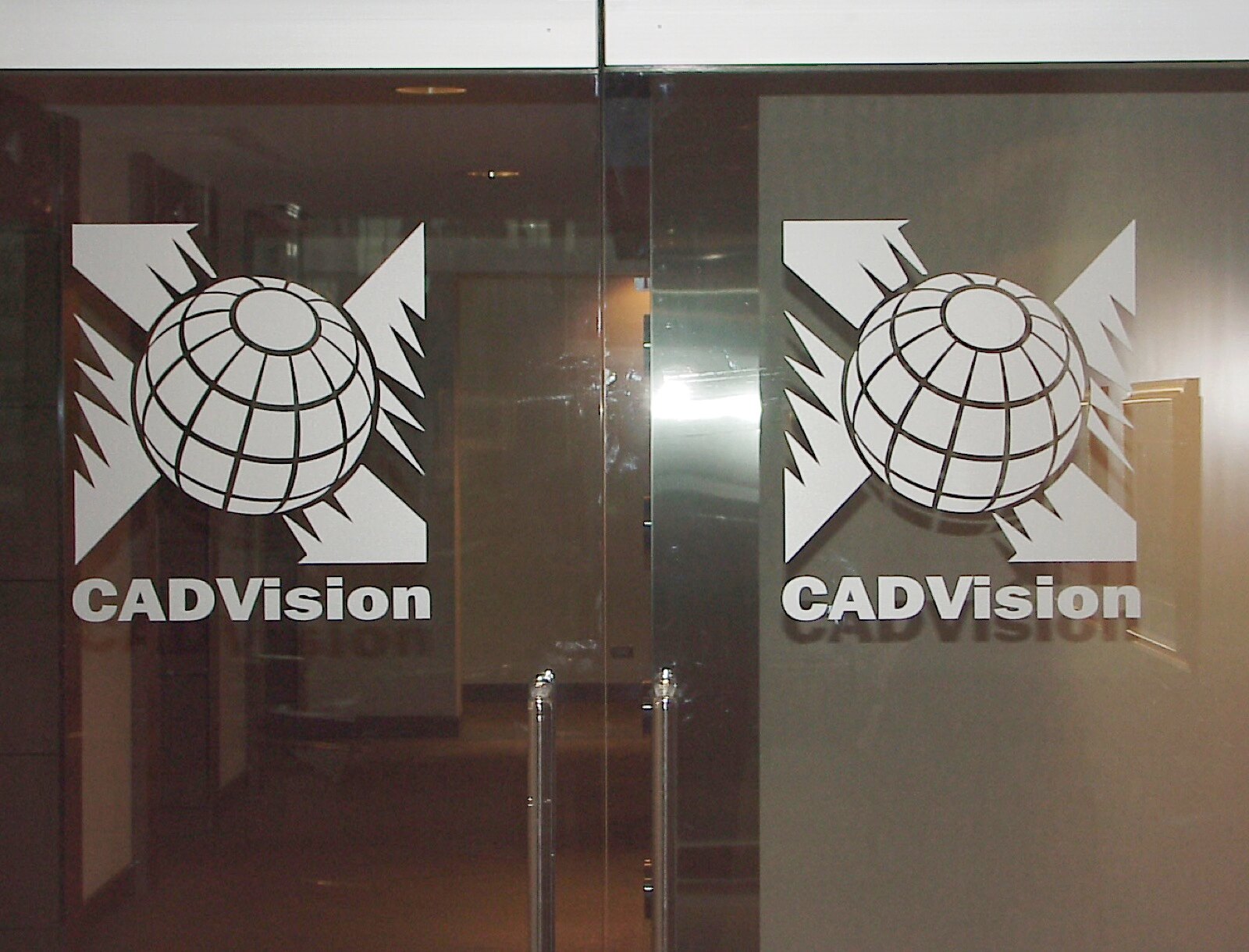 Etched-glass entrance doors — the CADVision globe logo
