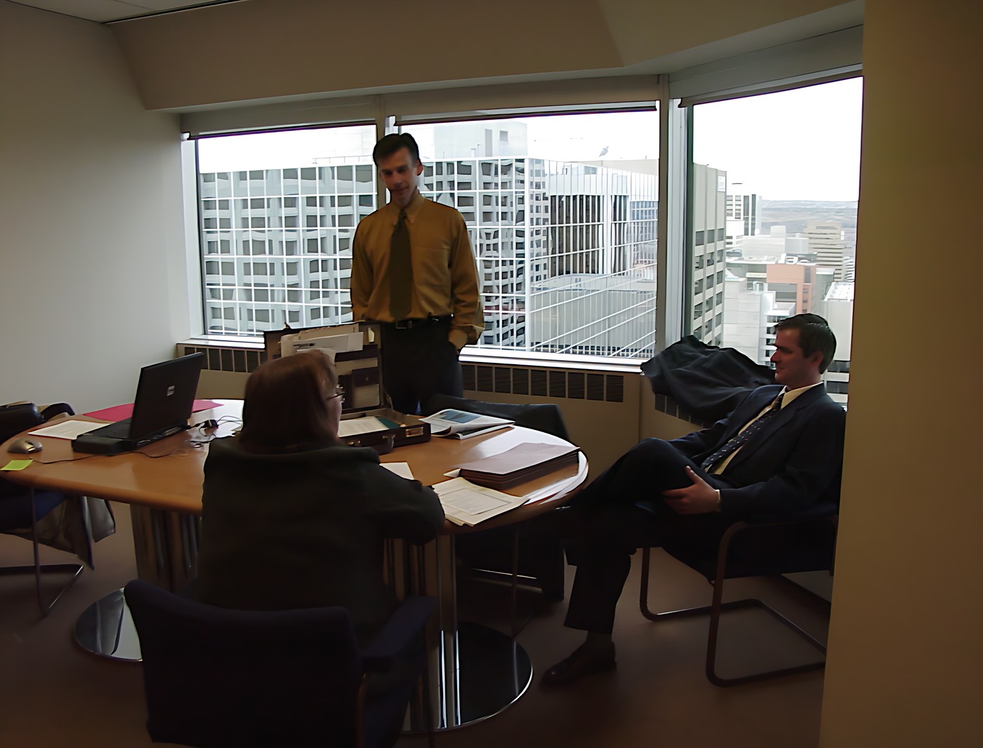 Group of three people in an office setting
